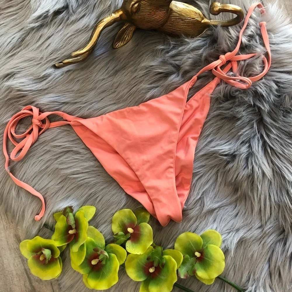 Frankie’s bikinis “Mistos” scrunch bottom in coral. Size M